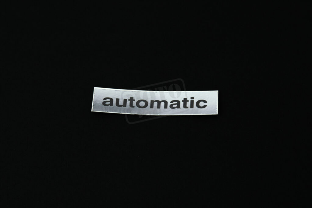 Samolepka "automatic" na nosič černá se stříbrným pozadím Babetta 210
